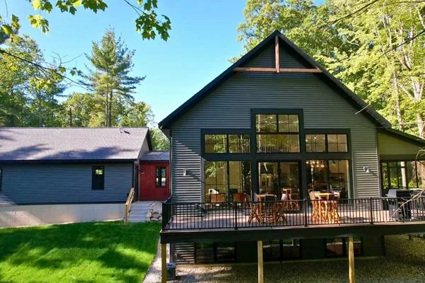 The covered back porch of The Gable looking out into the trees